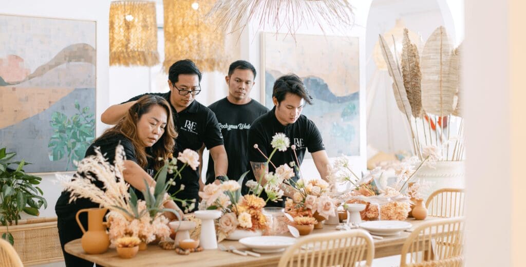 RYE Team creating a wedding table set up